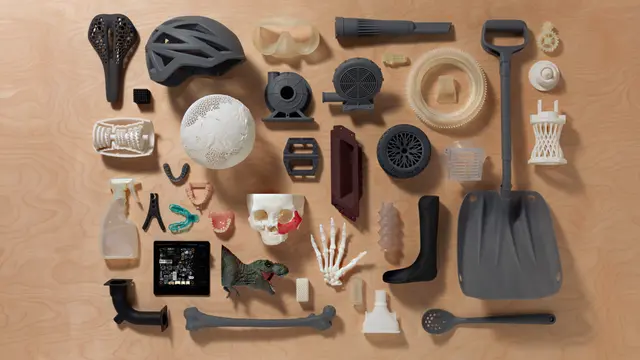 a wooden table with formlabs 3D printed parts on it